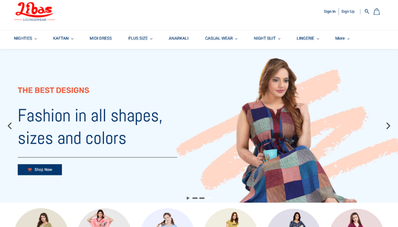 Libas Loungewear homepage featuring soft pastel color palette with white background, calming tones, hero image of woman in colorful midi dress, clear navigation menu (Nighties, Kaftan, Midi Dress, Plus Size, Anarkali, Casual Wear, Night Suit, Lingerie) and Shop Now button