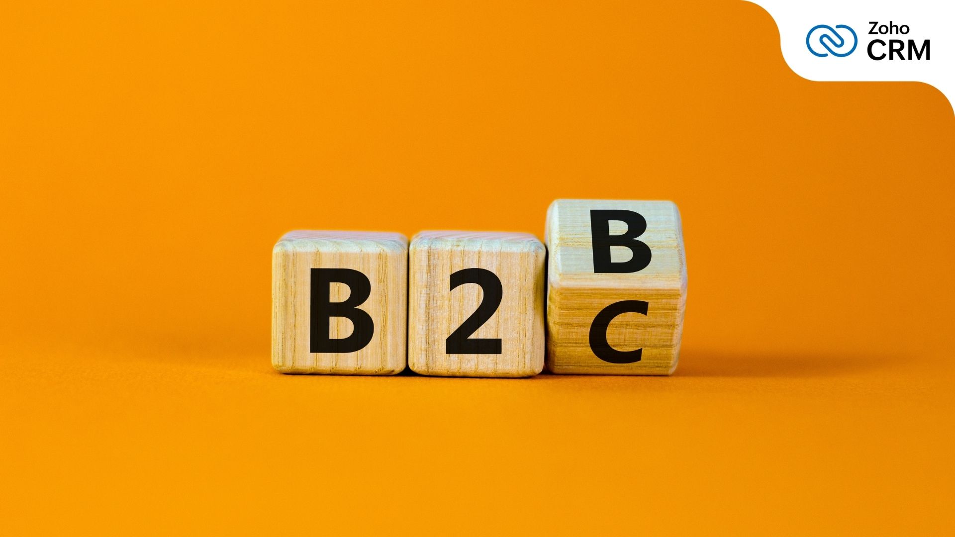 Three dice side by side, the first two reading B and 2, while the last one hovers between B and C