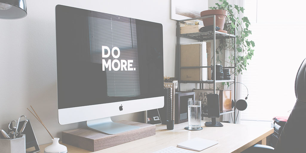 image of an iMac screen with the text 'do more' on it