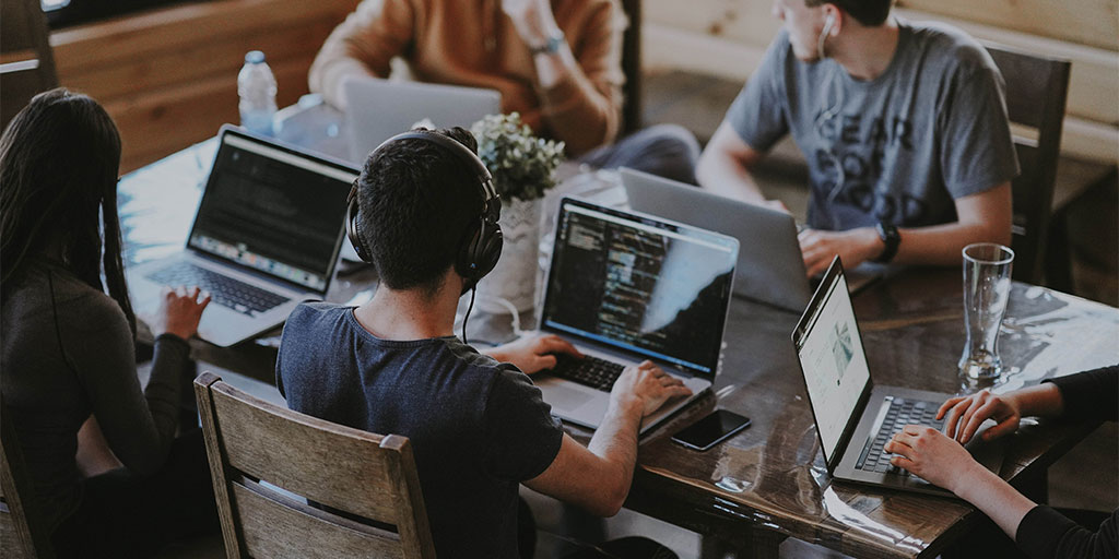 People working on their laptop to answer customer queries