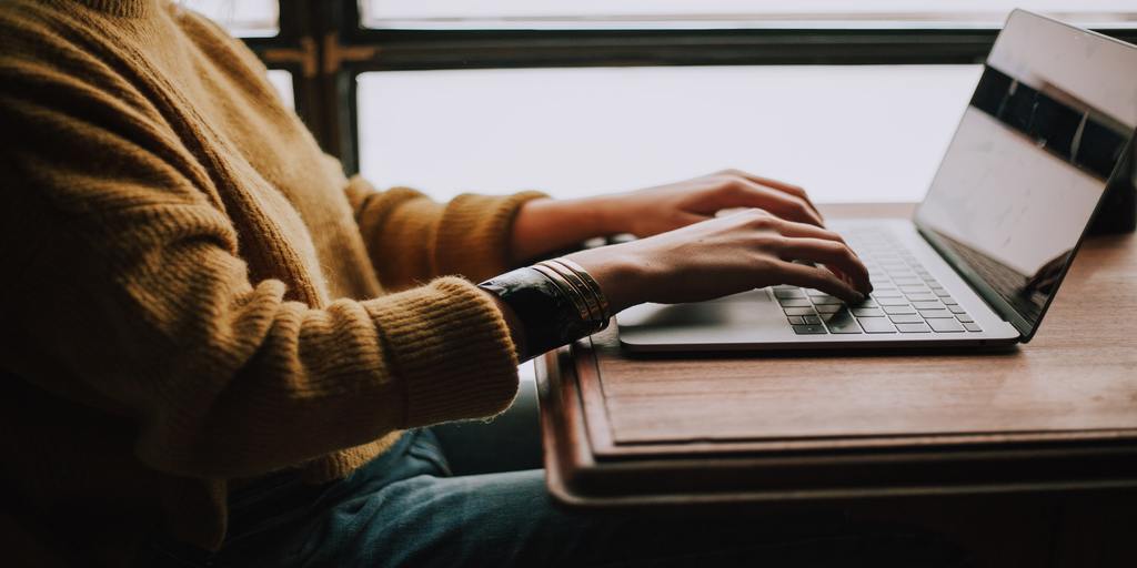 Person sending emails through a laptop