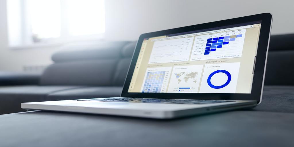 image of an open laptop with an business analytics dashboard on screen