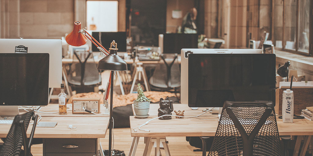 image of an office workplace with two desks next to each other