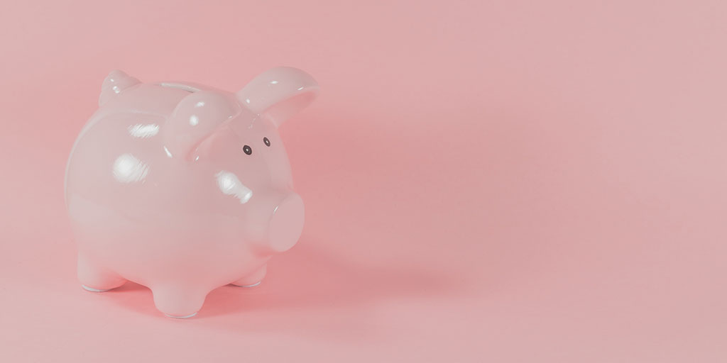 a pink piggy bank on a pink background