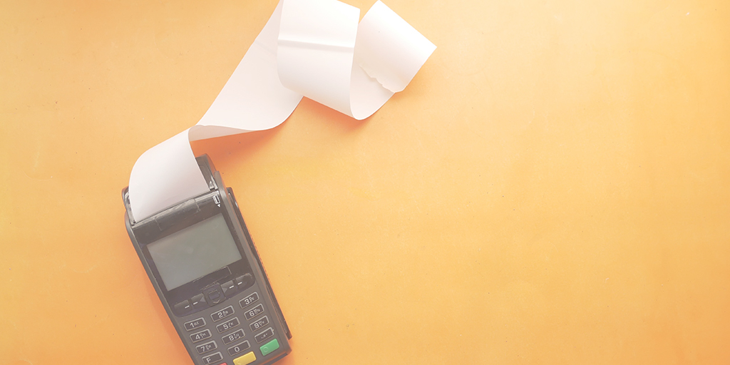 photo of a Eftpos machine with receipt paper