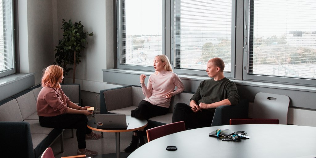 a group of professionals having a conversation