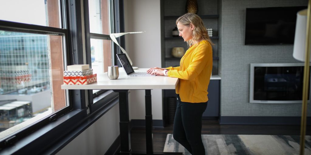 A woman is working on her laptop