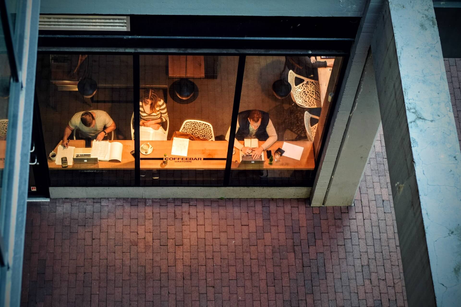 people working in a cafe